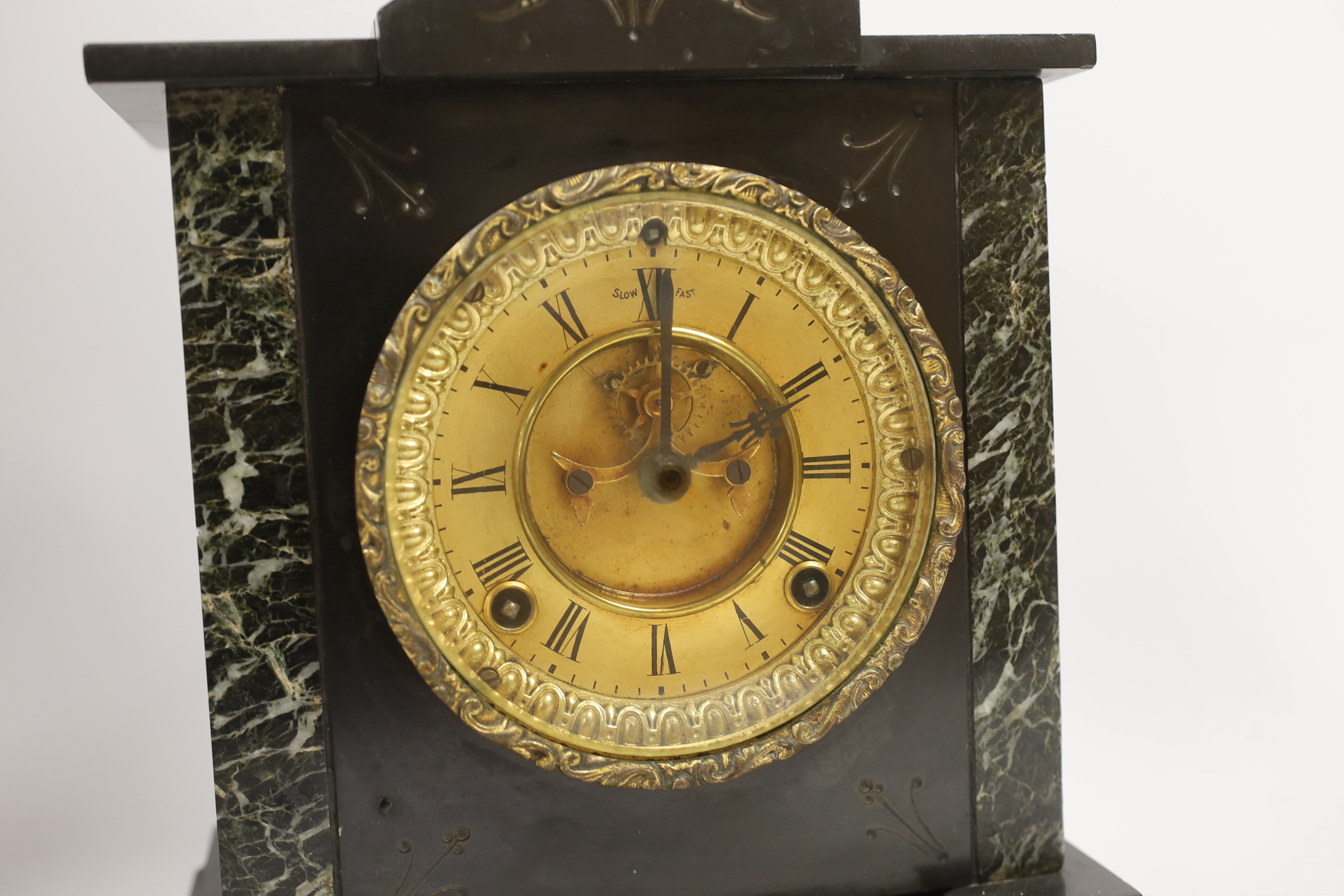 A Victorian slate mantel clock